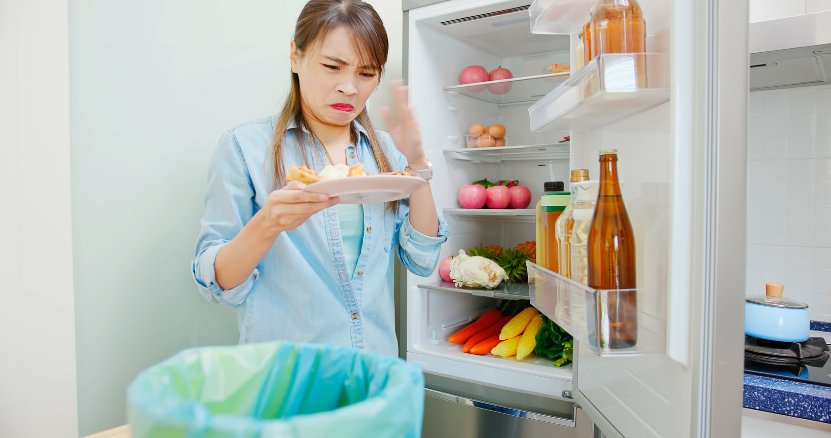 Woman Is Pouring Food Waste